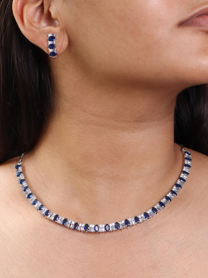 A closeup image of a girl wearing Single Layered Blue Diamond Necklace Set by Live Some India