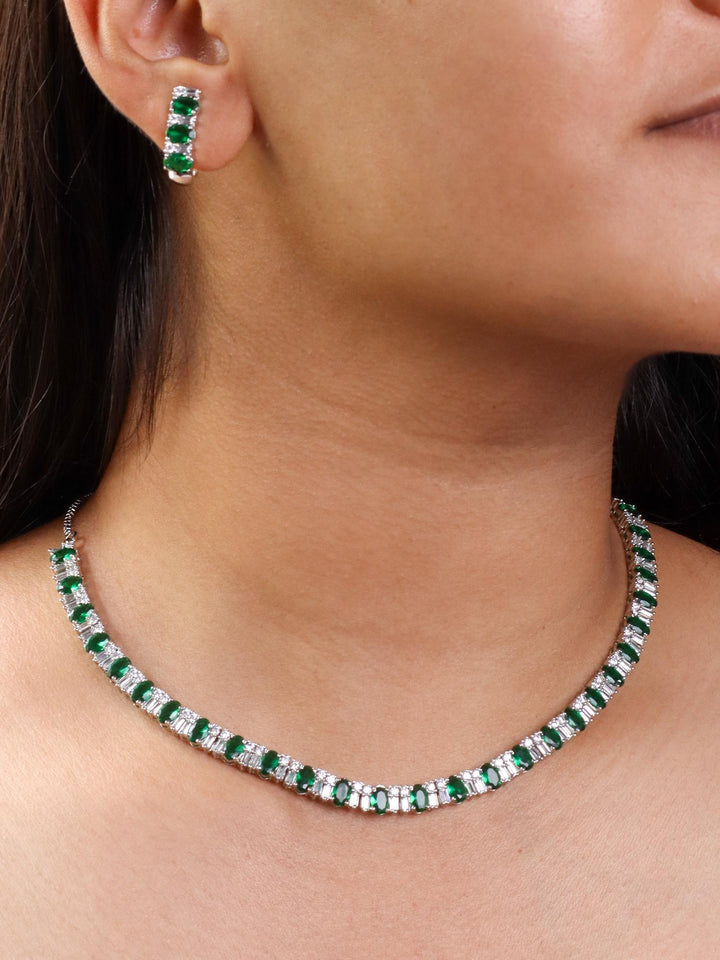 A closeup image of a girl wearing Single Layered Green Diamond Necklace Set by Live Some India 