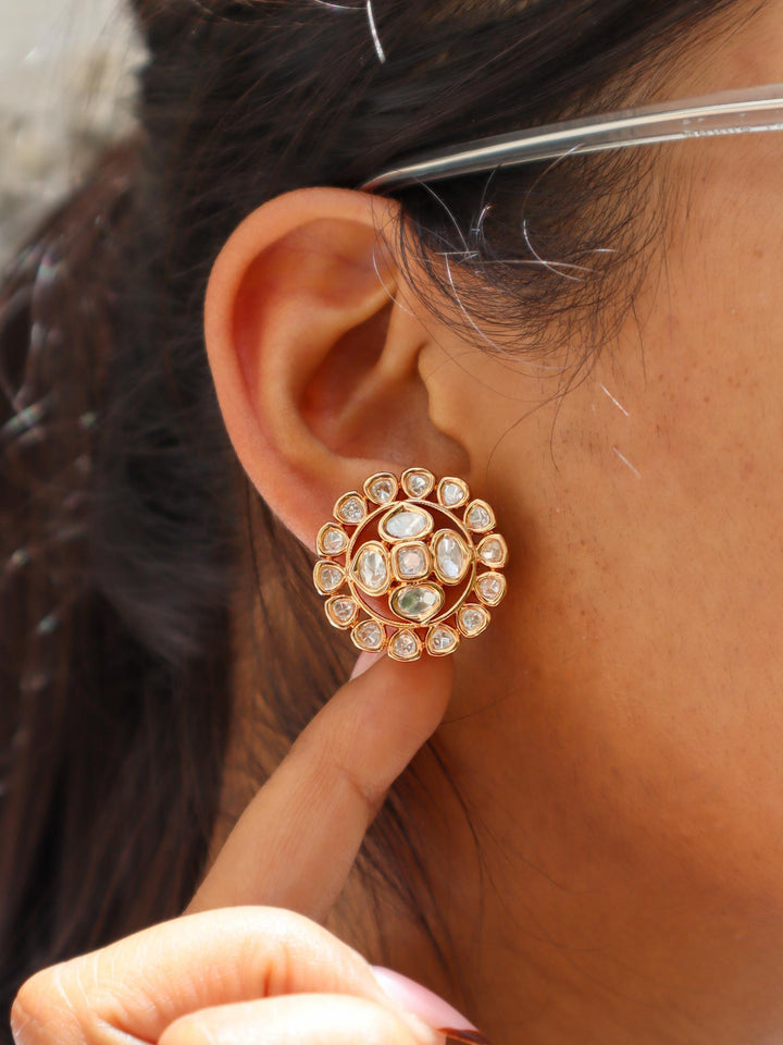 A closeup image of a girl wearing Siya Kundan Polki Stud Earrings -4 by LIve Some India 