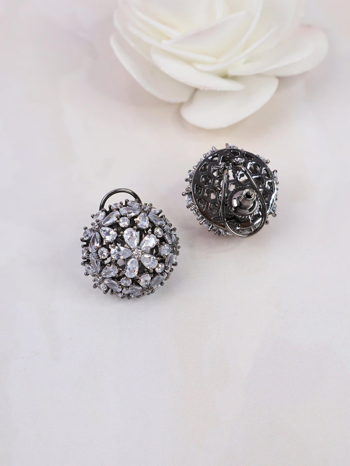 A closeup image of Starry White Contemporary Stud Earrings 1 by Live Some India on a white background with a white rose