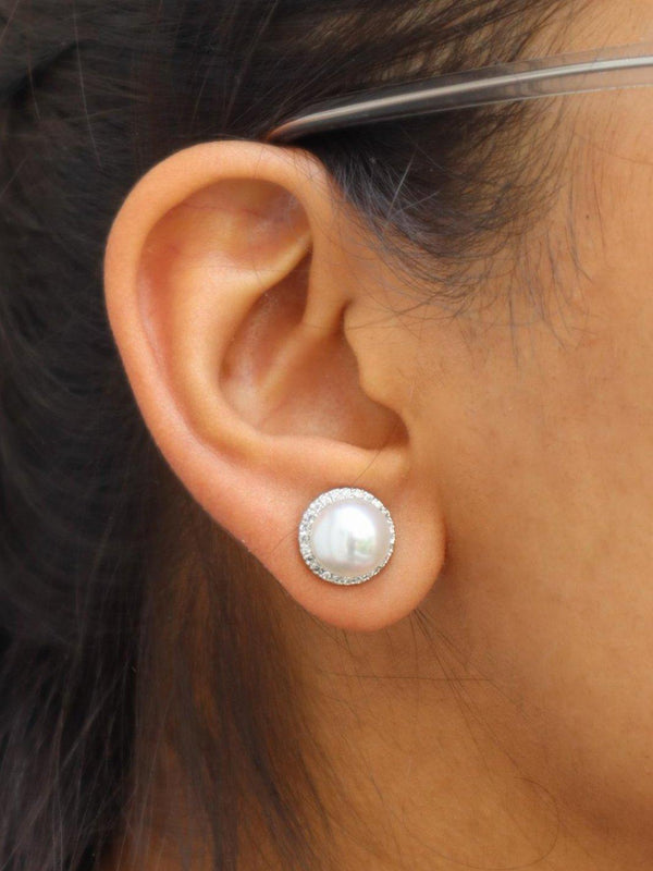 A closeup image of Statement Pearl Earrings by Live Some India 