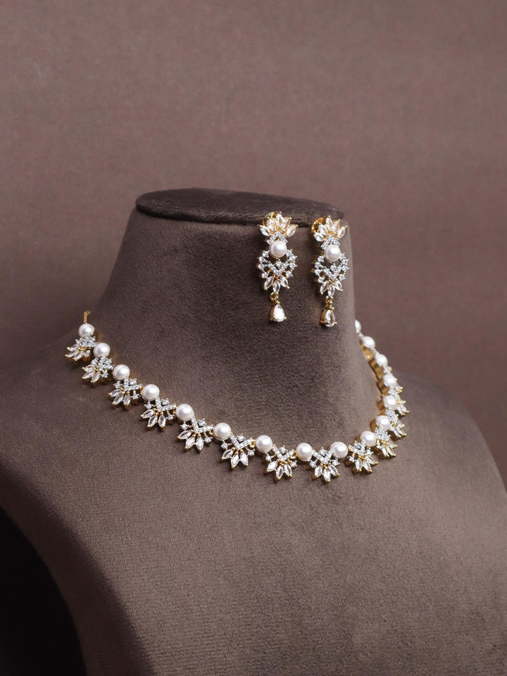 A closeup image of Sunrise Pearl Necklace Set -5 by Live Some India on a brown dummy 