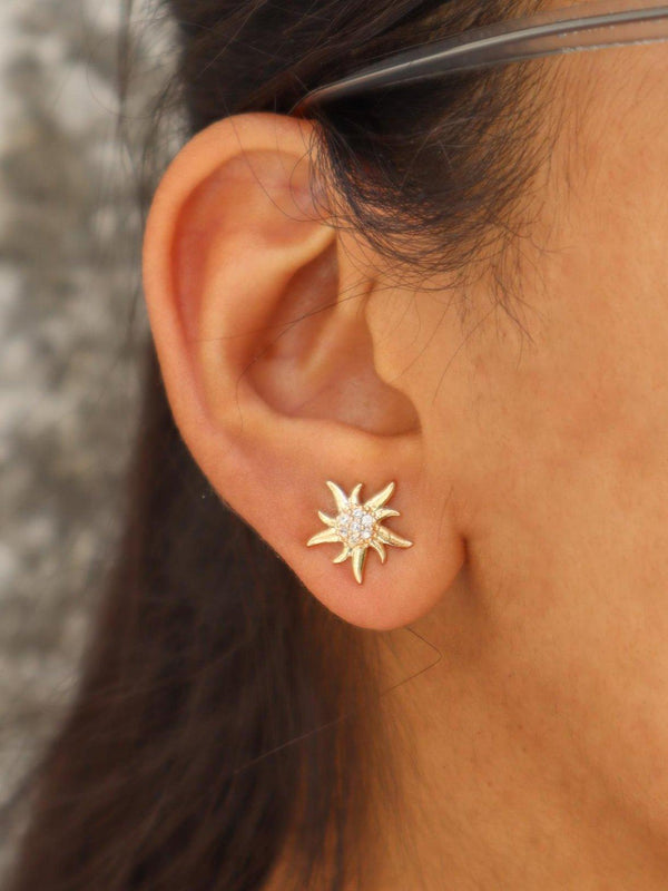 A closeup image of a girl wearing Sunshine Earrings by Live Some India 