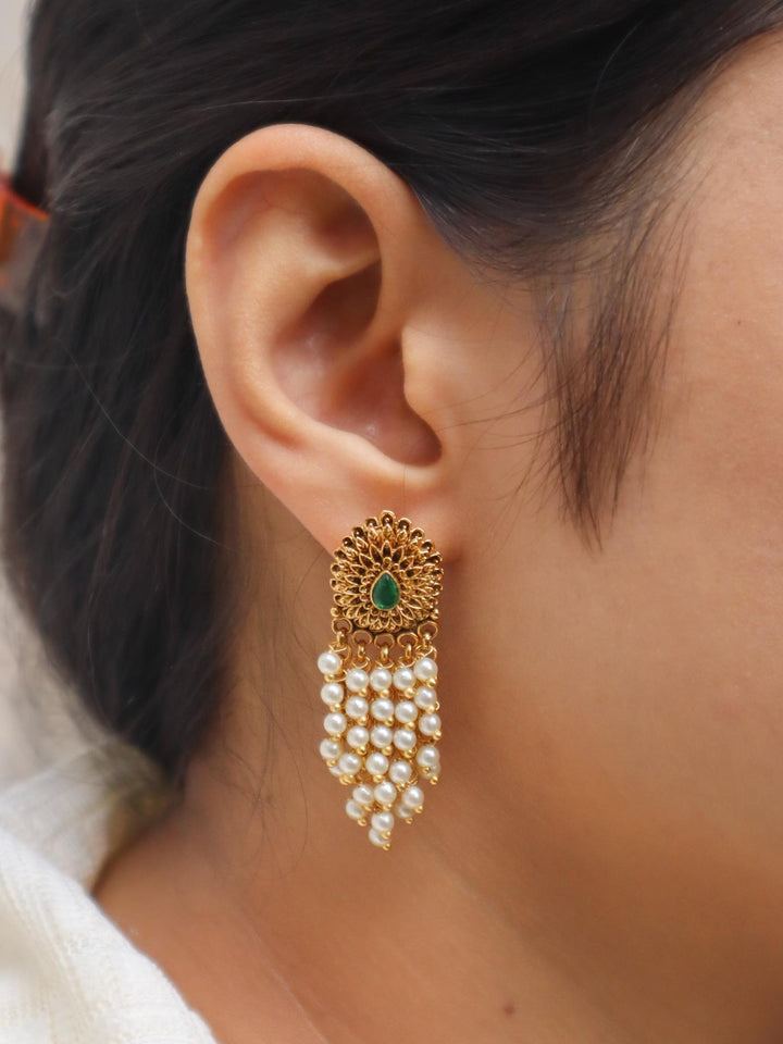 Girl wearing Temple Pearl Drops Dangle Earrings by Live Some India