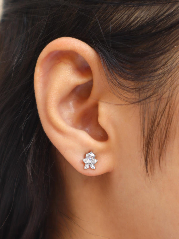 Girl wearing Tia Diamond Flower Earrings by Live Some India