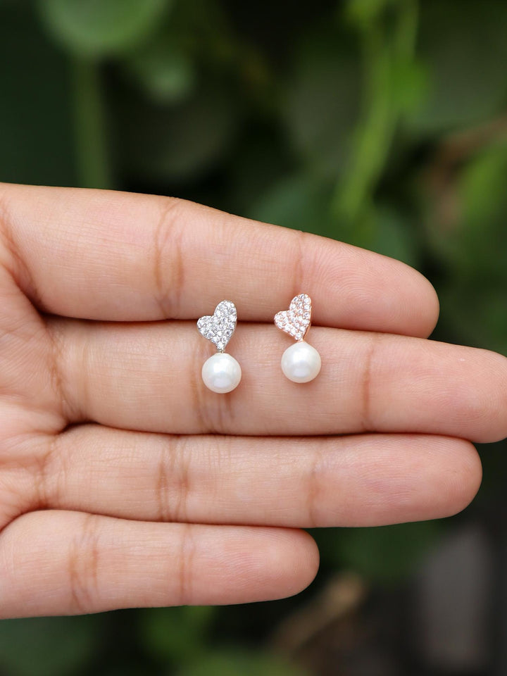 A closeup image of Tilted Heart with Pearl Earrings by Live Some India 