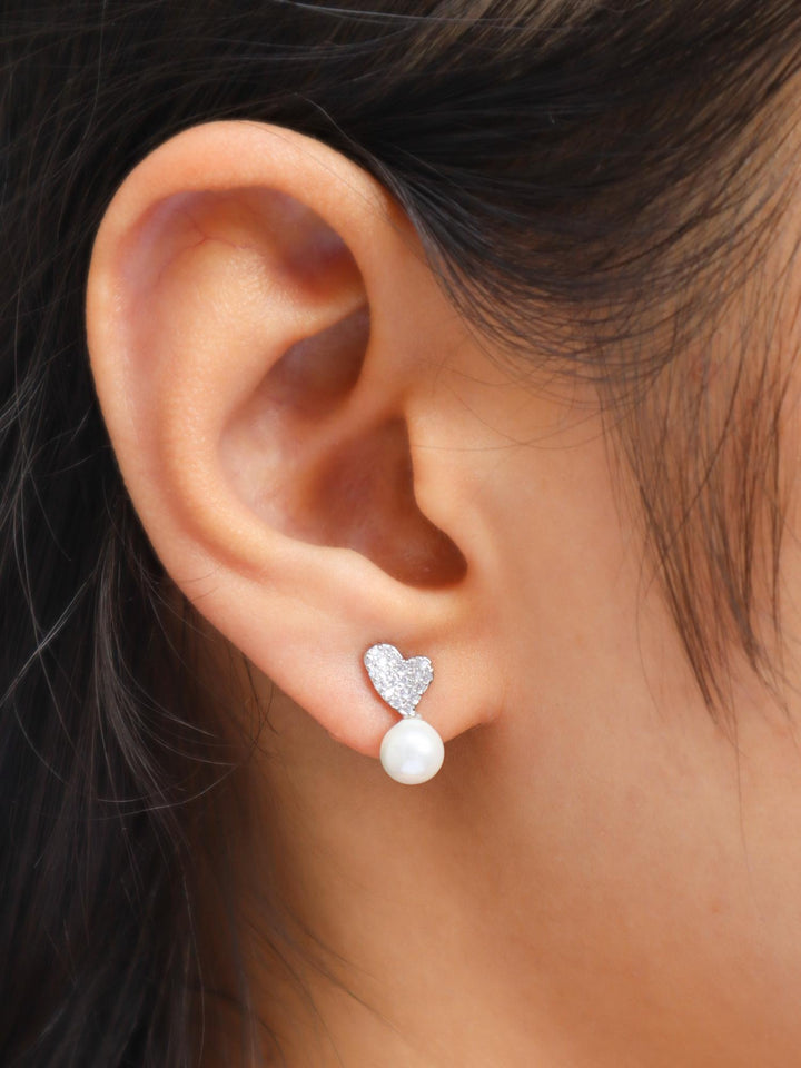 Girl wearing Tilted Heart with Pearl Earrings by Live Some India