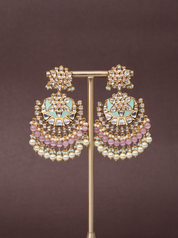 A closeup image of Trendy Green Kundan Polki Chandbali Earrings -1 by Live Some India on a brown background 