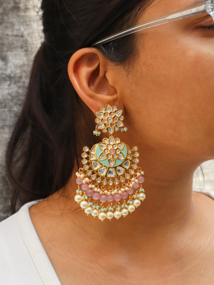 A closeup image of a girl wearing Trendy Pastel Kundan Polki Chandbali Earrings by Live Some India 