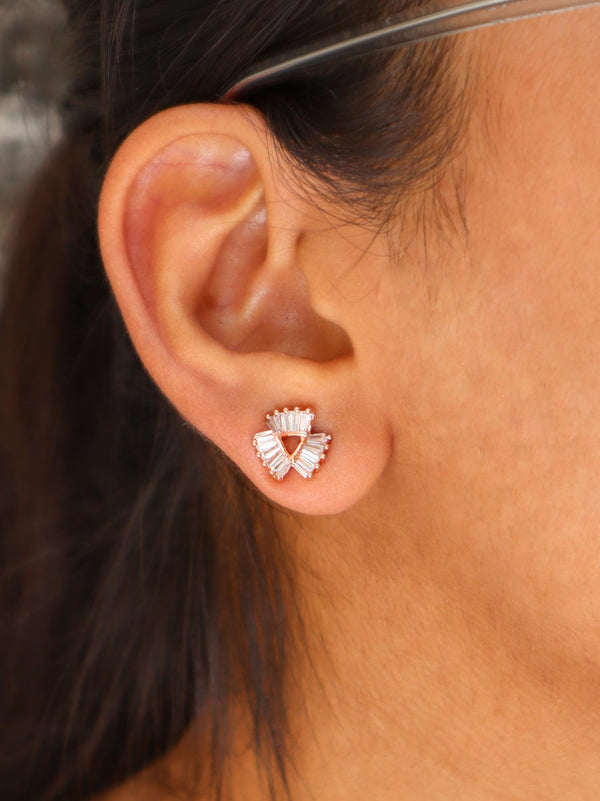 A closeup image of a girl wearing Triangular folded Crystal Earrings by Live Some India 