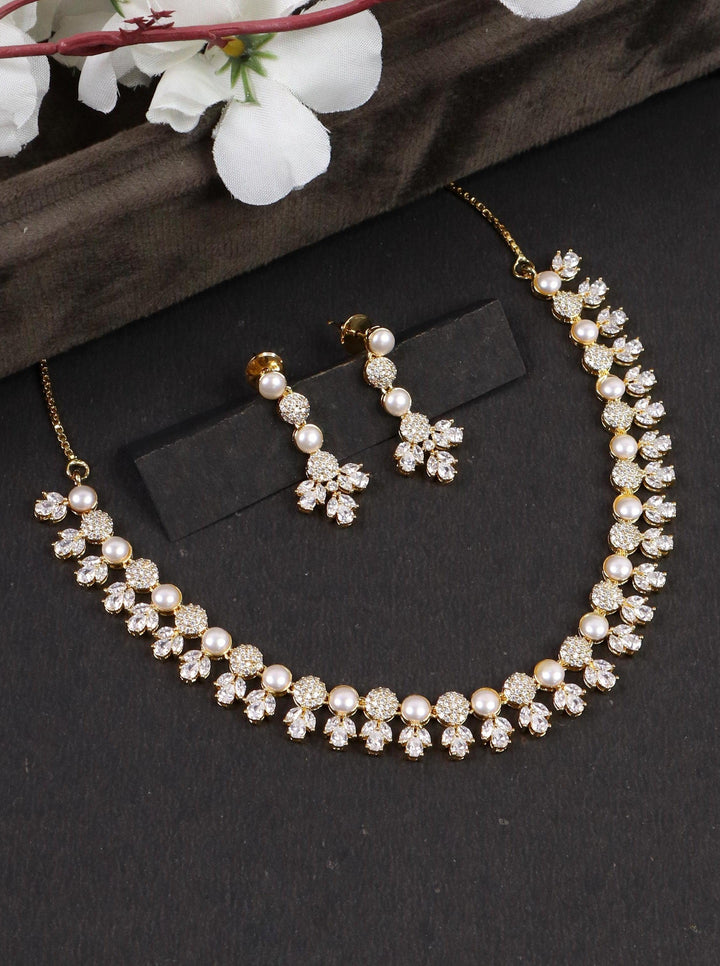 A closeup image of Tulip Pearl Necklace Set by Live Some India on a black background 