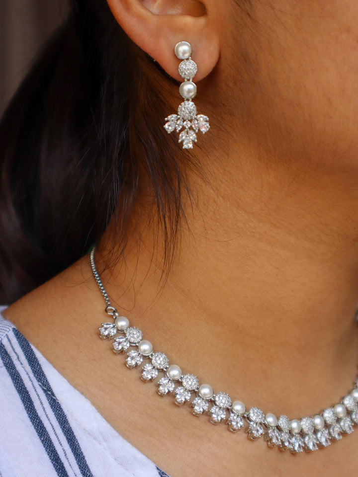 A closeup image of a girl wearing Tulip Pearl Necklace Set -3 by Live Some India 