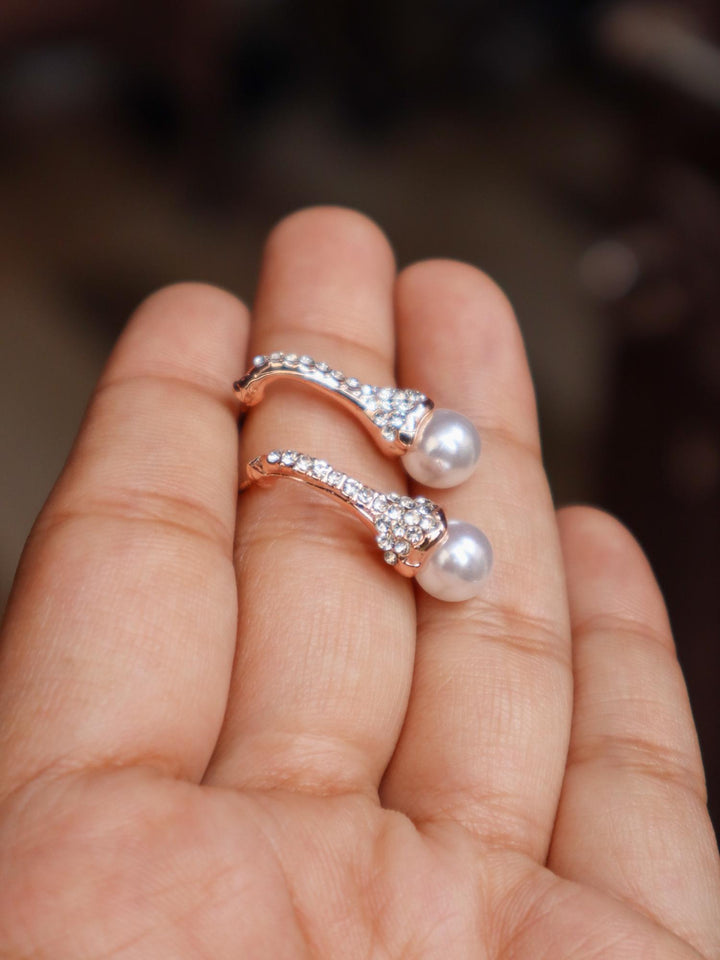 A closeup image of a girl holding Umbrella Rose Gold Earrings -2 by Live Some India 