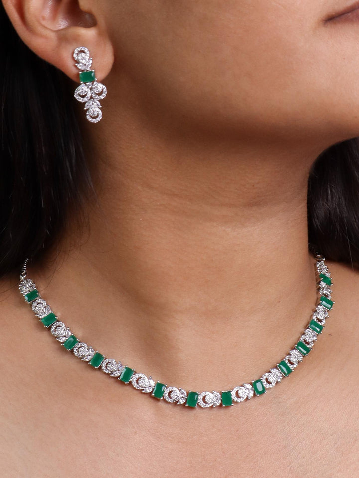 A closeup image of a girl wearing Unique Emerald Diamond Necklace Set -3 by Live Some India 