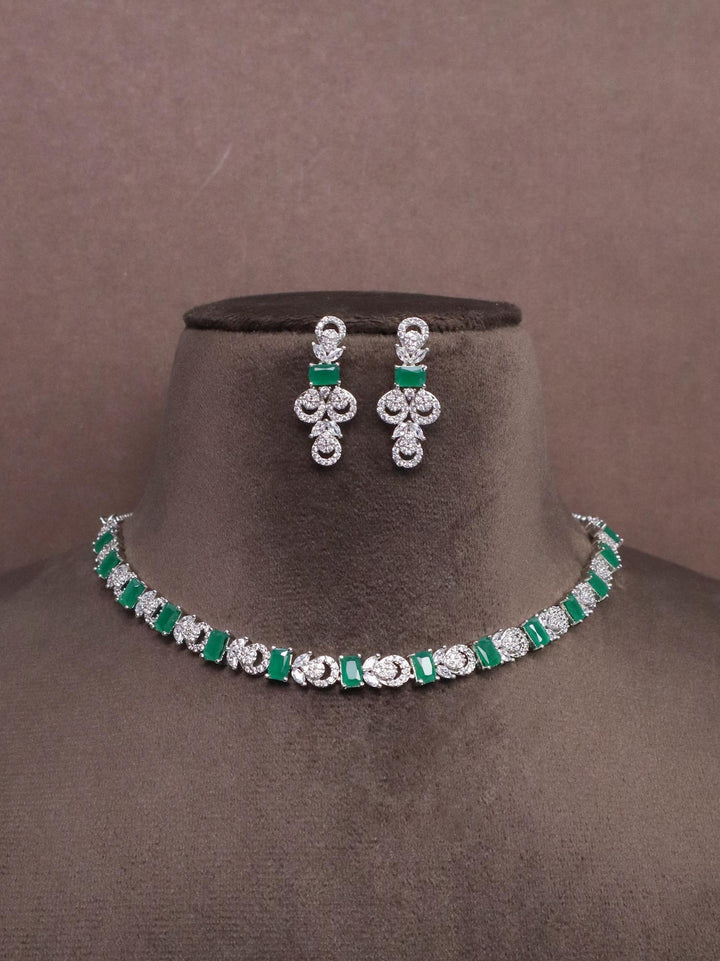 A closeup image of Unique Emerald Diamond Necklace set -2 by Live Some India on a brown dummy 