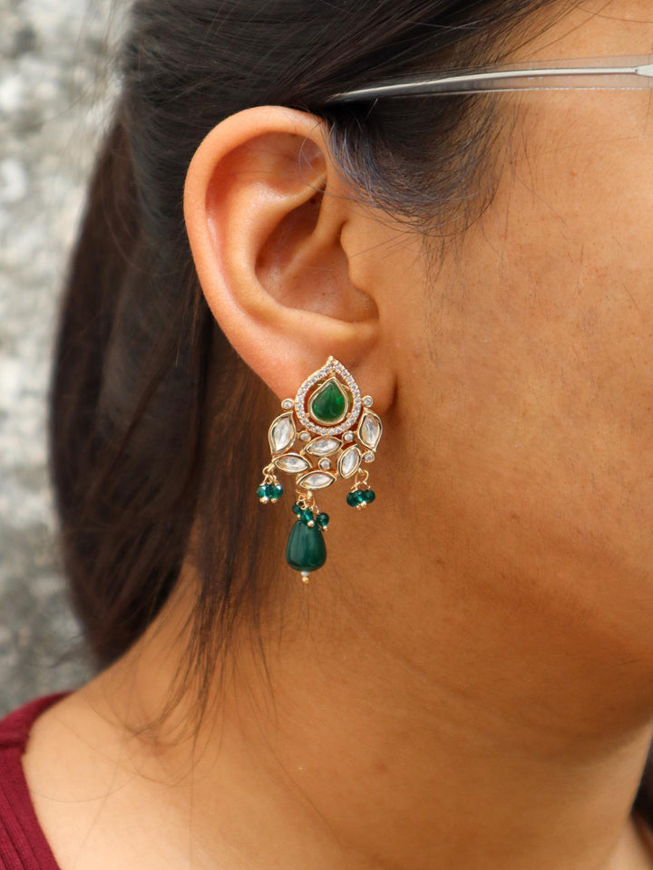 A closeup image of a girl wearing Urja Pearl Kundan Polki Earrings by Live Some India 