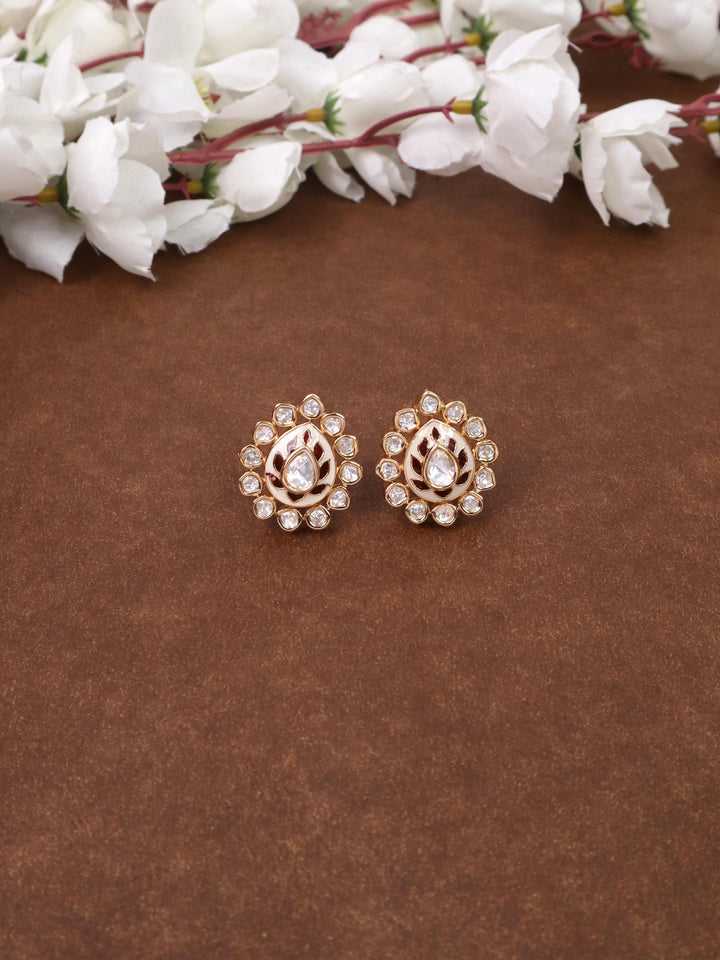 A closeup image of Uryam Kundan Polki Stud Earrings -4 by Live Some India on a brown background 