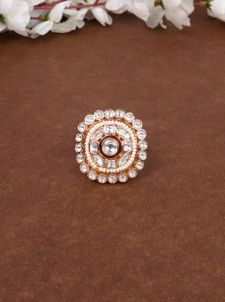 A closeup image of Vanya Beaded Kundan Polki Ring -1 by Live Some India on a brown background