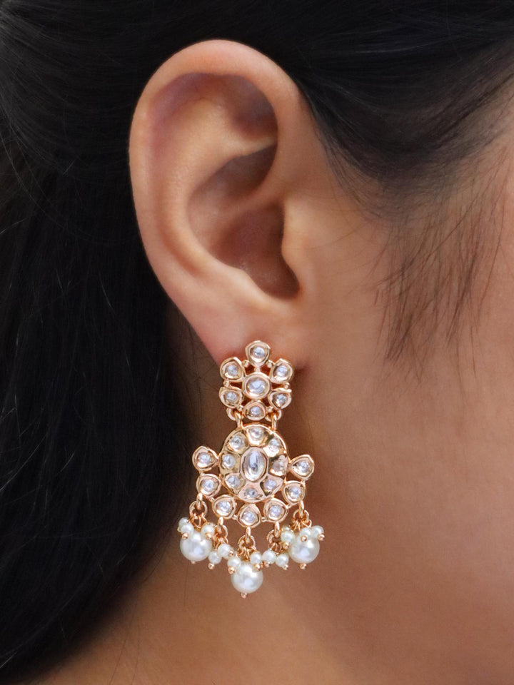 Girl wearing Vanya Kundan Polki Dangle Earrings with Pearls by Live Some India