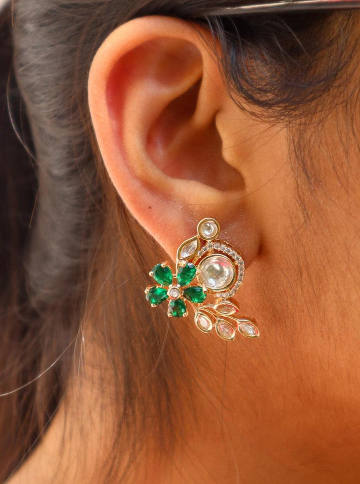 A closeup image of a girl wearing Veena Kundan Polki Stud Earrings by Live Some India 