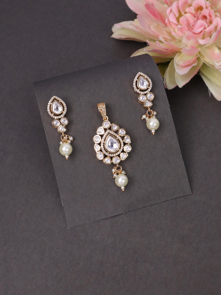 A closeup image of White Pastel Pearl Drop Pendant Set by Live Some India on a black background 