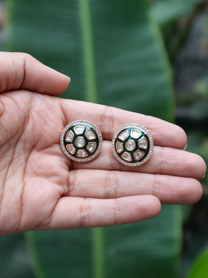 Alia Green Menakari Stud Earrings - by Live Some India in just Alia Green Menakari Stud Earrings by Live Some India on hands with natural green leaves background.