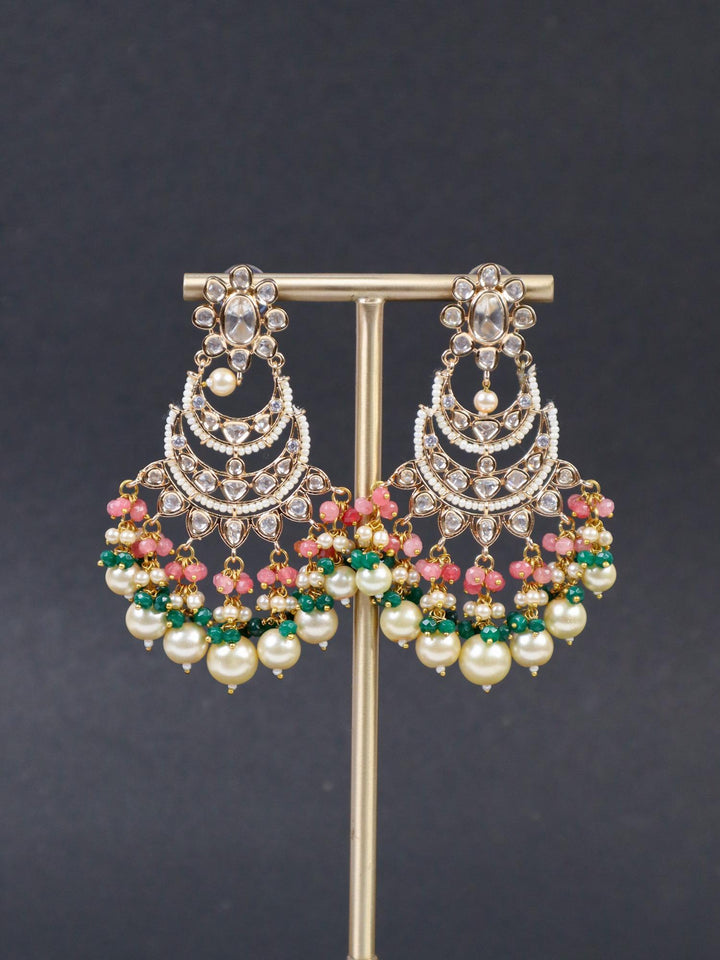 Anvika Kundan Polki Chandbali Dangle Earrings - by Live Some India in just Anvika Kundan Polki Chandbali Earrings - by Live Some India in just A closeup image of Anvika Pink Kundan Polki Chandbali Earrings - 2 by Live Some India on a black background