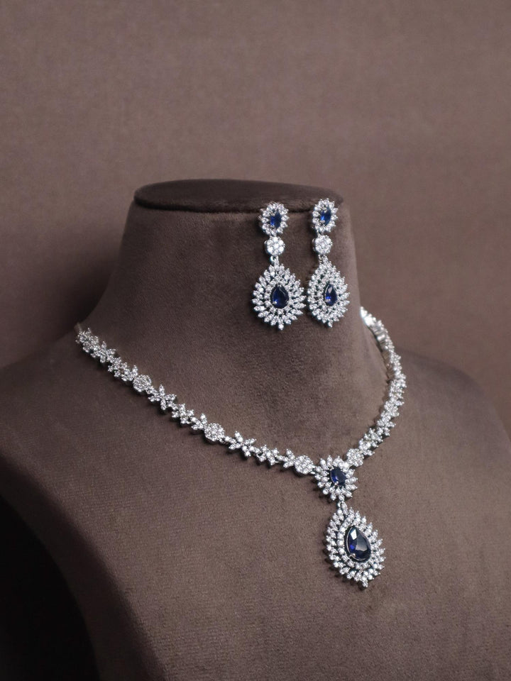 Blue Sapphire Statement Diamond Necklace Set - by Live Some India in just A closeup image of Blue Sapphire Statement Diamond Necklace Set by Live Some India on a brown dummy