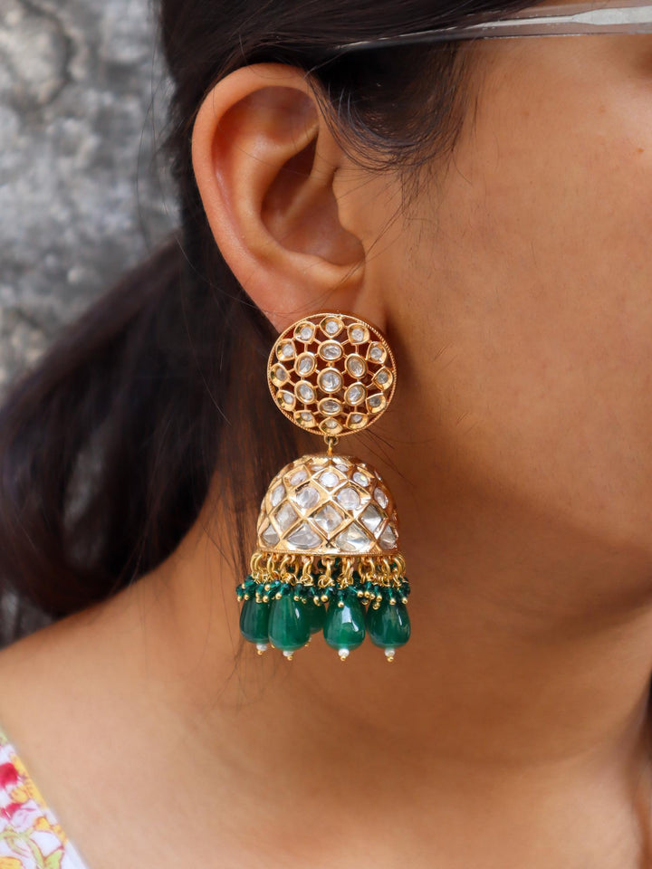 Chakra Kundan Polki Jhumka Earrings - by Live Some India in just Chakra Kundan Polki Jhumka Earrings - by Live Some India in just A closeup image of a girl wearing Chakra Kundan Polki Jhumka Earrings by Live Some India