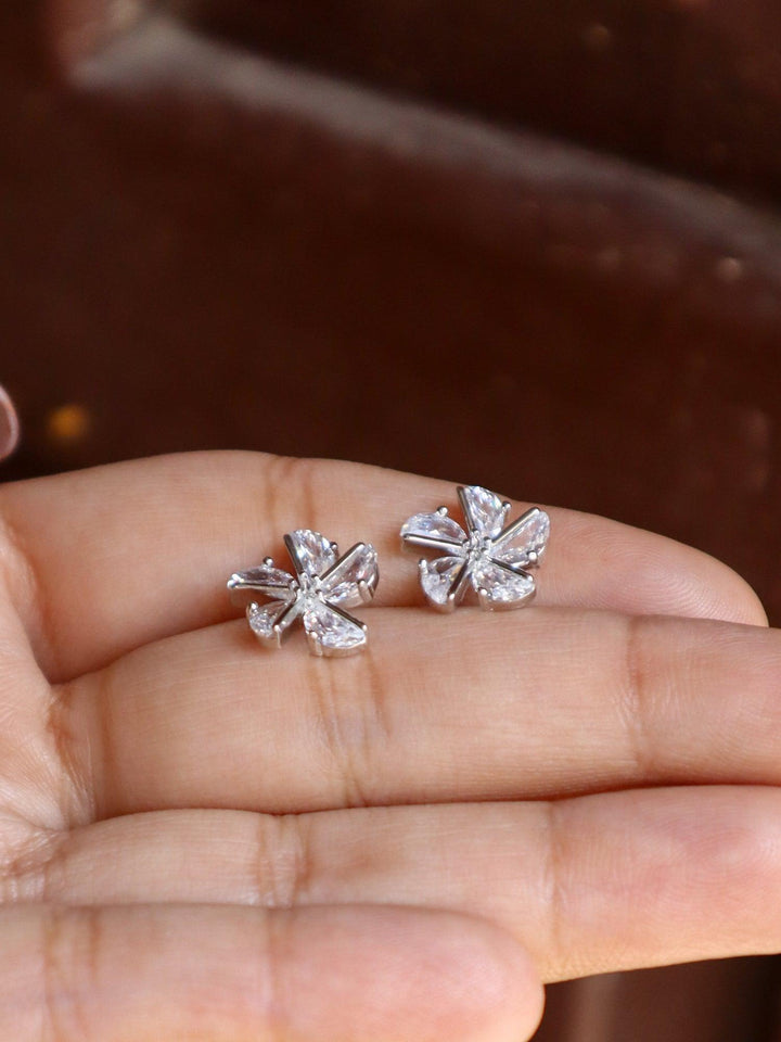 Crystal Flower Earrings - by Live Some India in just A closeup image of Crystal Flower Earrings 2 by Live Some India on a girl's hand