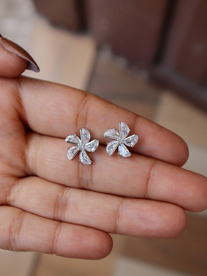 Crystal Flower Earrings - by Live Some India in just A closeup image of Crystal Flower Earrings 3 by Live Some India on a girl's hand