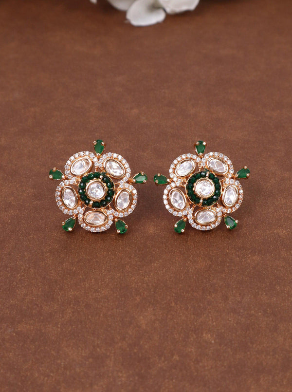 Daksha Kundan Polki Stud Earrings - by Live Some India in just Daksha Kundan Polki Stud Earrings - by Live Some India in just A closeup image fo Daksha Kundan Polki Green Stud Earrings by Live Some India on a yellow satin cloth with flowers