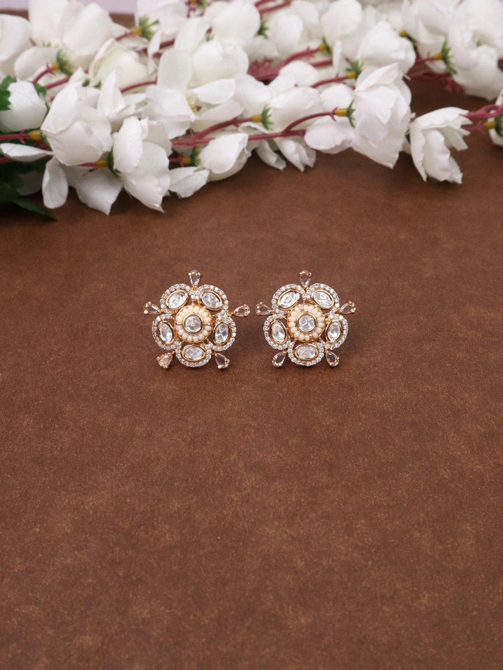 Daksha Kundan Polki Stud Earrings - by Live Some India in just A closeup image of Daksha White Kundan Polki Stud Earrings by Live Some India on a brown background