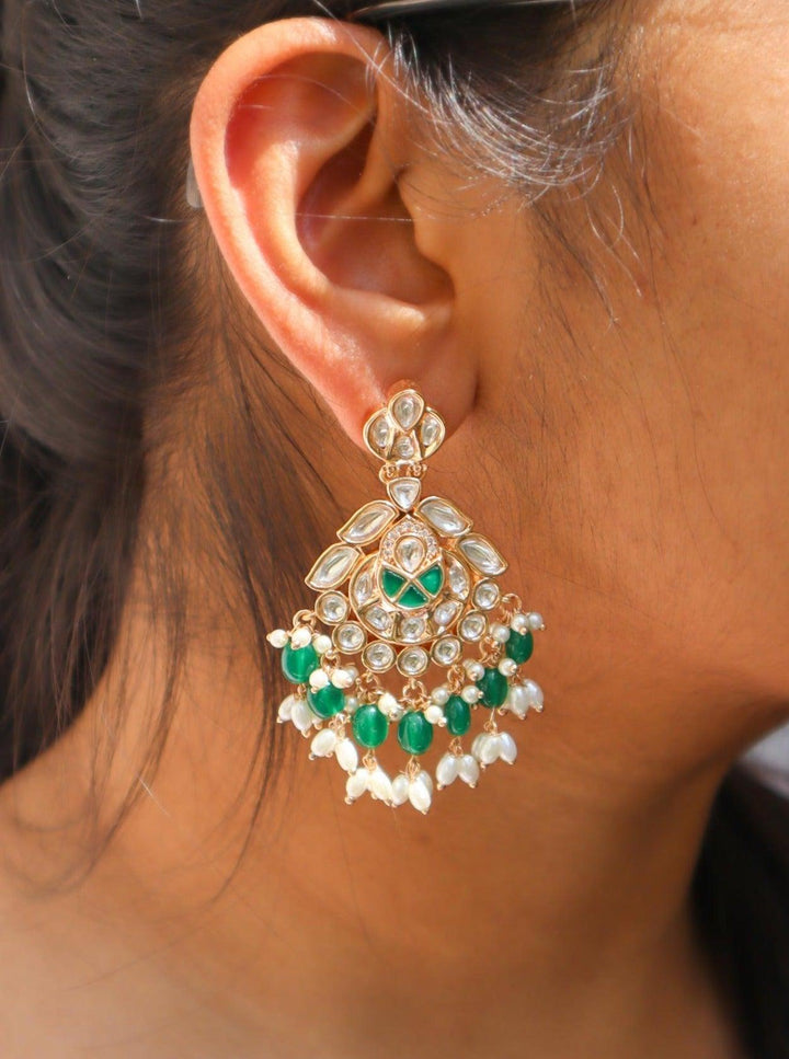 Esha Kundan Polki Dangler Earrings - by Live Some India in just A closeup image of a girl wearing Esha Kundan Polki Dangler Earrings by Live Some India