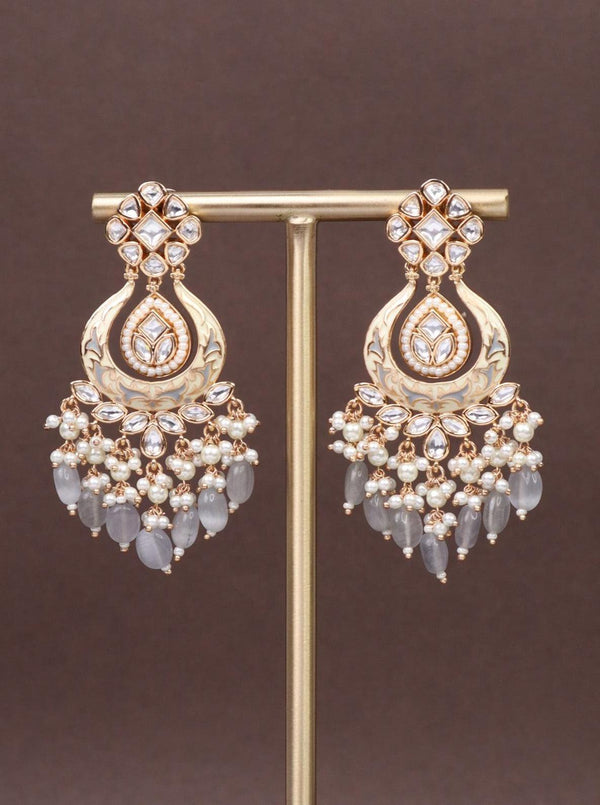 Grey Pearl Kundan Polki Dangler Earrings - by Live Some India in just A closeup image of Grey Pearl Kundan Polki Dangler Earrings by Live Some India on a brown background