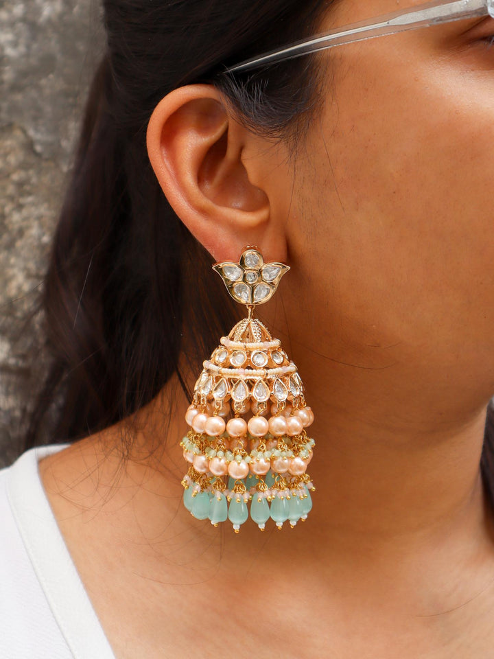 Idah Kundan Polki Jhumka Earrings - by Live Some India in just A closeup image of a girl wearing Idah Mint Green Kundan Polki Jhumka Earrings by Live Some India