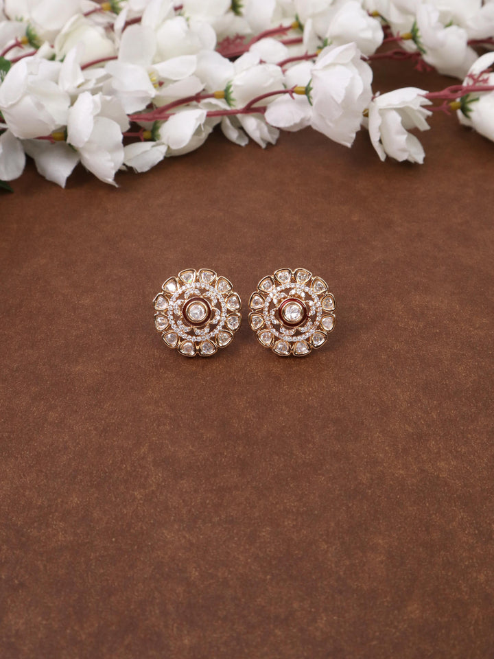 Maryam Kundan Polki Stud Earrings - by Live Some India in just A closeup image of Maryam Kundan Polki Blue Stud Earrings by Live Some India on a yellow satin cloth with flowers