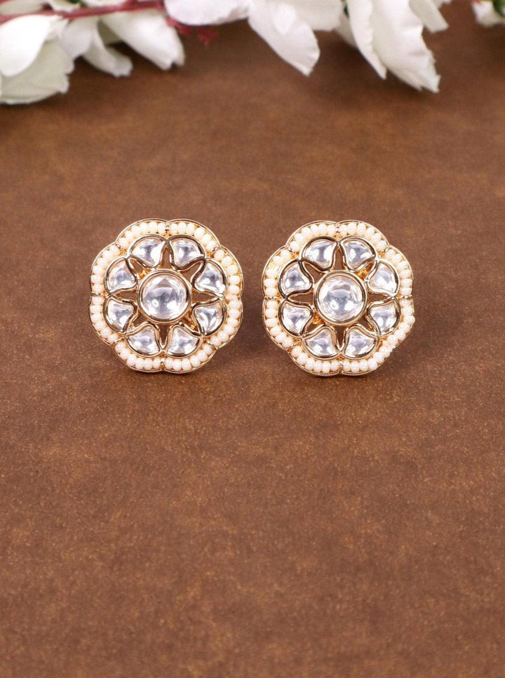 Maya Beaded Kundan Polki Stud Earrings - by Live Some India in just A closeup image of Maya Kundan Polki Stud Earrings by Live Some India on a brown background with flowers