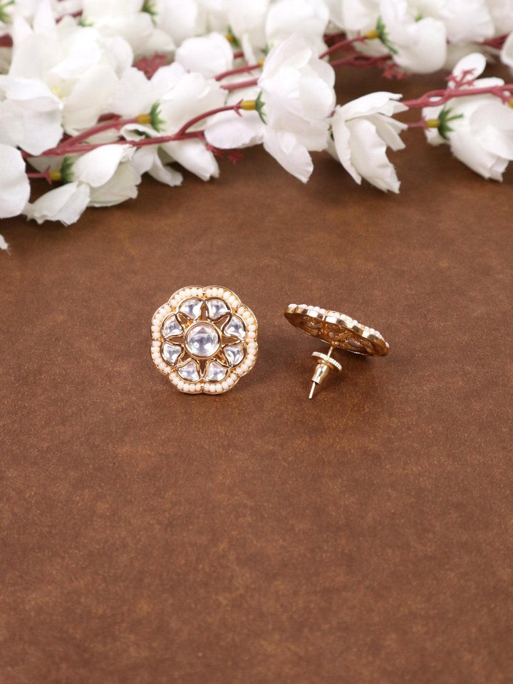 Maya Beaded Kundan Polki Stud Earrings - by Live Some India in just A closeup image of Maya Kundan Polki White Stud Earrings -1 by Live Some India on a brown background with flowers