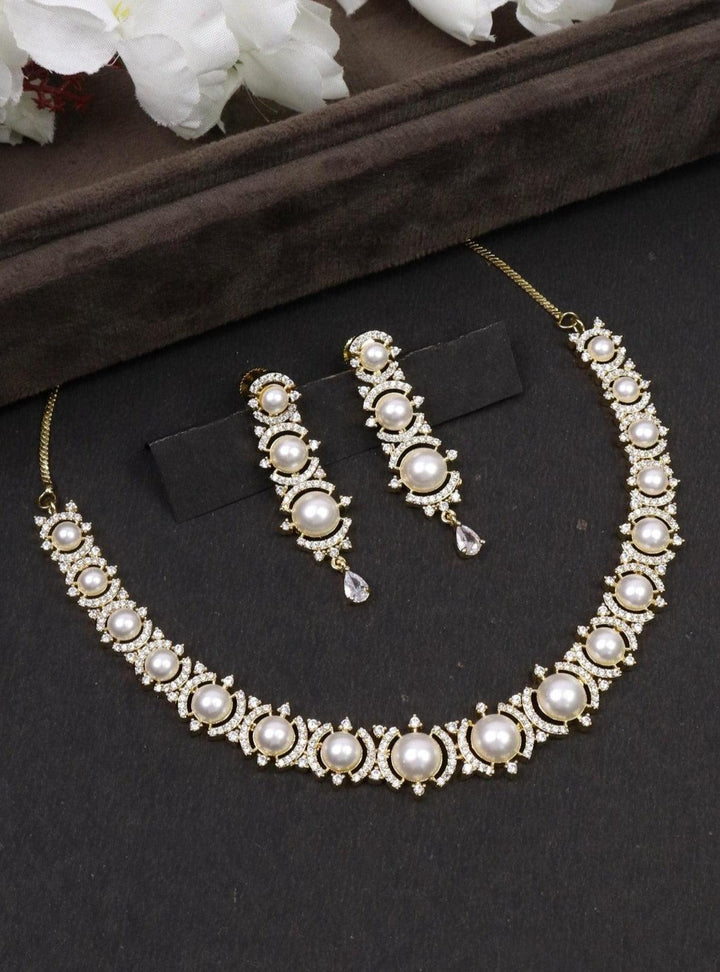 Mitali Pearl Necklace Set - by Live Some India in just A closeup iamge of Mitali Pearl Necklace by Live Some India on a black background with brown tray and flowers