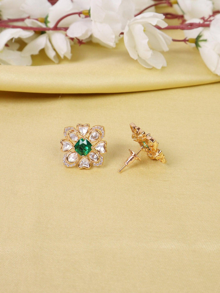 Zoya Kundan Polki Stud Earrings - by Live Some India in just A closeup image of Zoya Kundan Polki Green Stud Earrings -1 by Live Some India on a yellow satin cloth with flowers