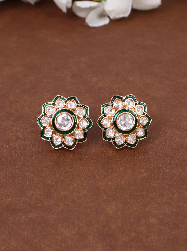 Falak Kundan Polki Stud Earrings - by Live Some India in just A closeup image of Falak Kundan Polki Stud Earrings by Live Some India on a yellow satin background with flowers