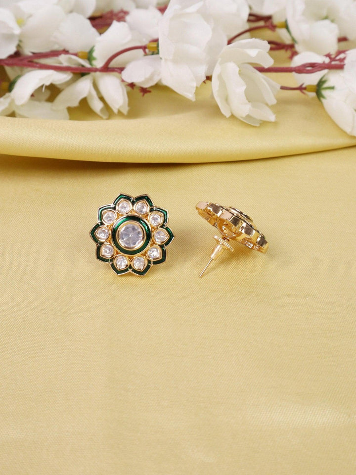 Falak Kundan Polki Stud Earrings - by Live Some India in just A closeup image of Falak Kundan Polki Green Stud Earrings by Live Some India on a yellow satin cloth with flowers