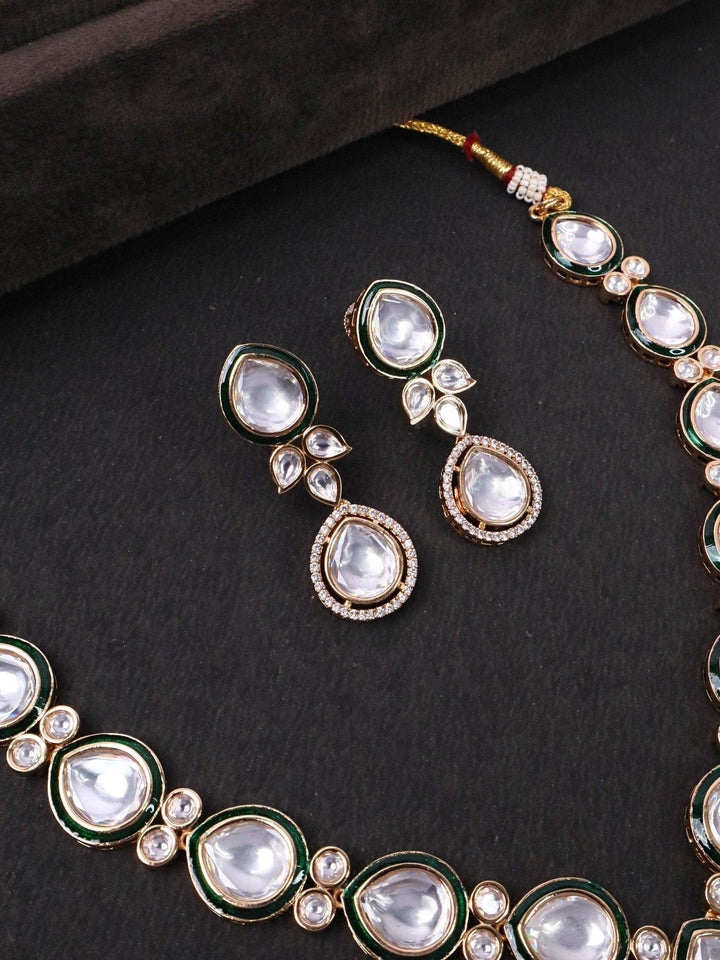 Green Menakari Vasi Kundan Polki Necklace Set - by Live Some India in just Close up image of Green Menakari Vasi Kudan Polki Necklace Set Earrings on a black background.