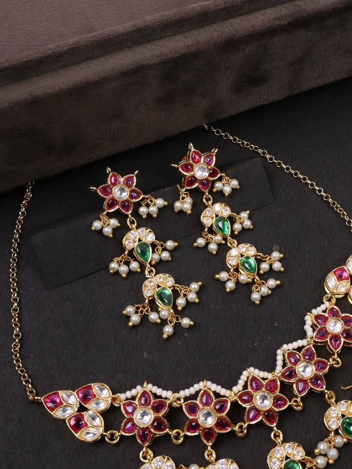 Jadau Kundan Polki Choker Necklace Set - by Live Some India in just A closeup image of Jadau Kundan Polki Choker Earrings by Live Some India on a black background