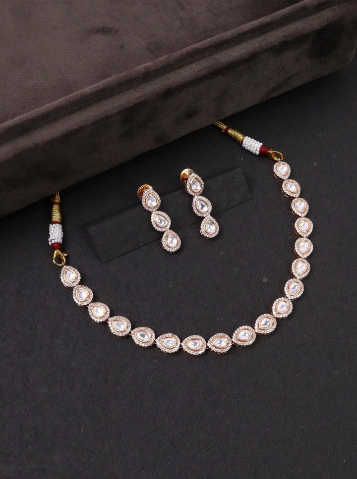 Nira Single Line Kundan Polki Necklace Set - by Live Some India in just Nira Kundan Polki Necklace by Live Some India on a black background